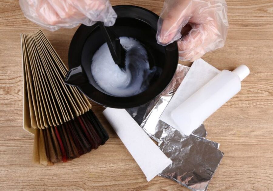 Hair stylist with hair samples of different colors, close-up